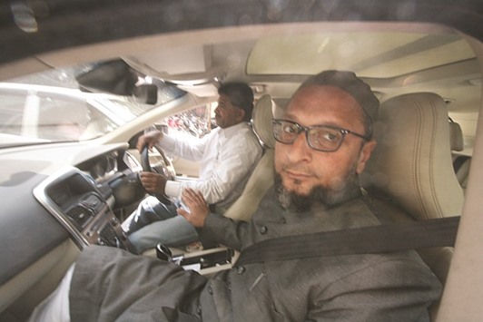 Owaisi leaves a court after getting bail in connection with an assault case, in Hyderabad yesterday.