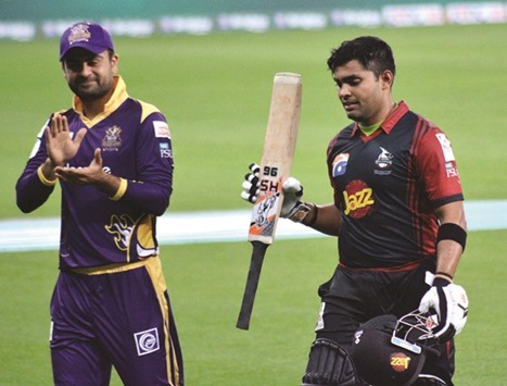 Umar Akmal is applauded by Ahmed Shehzad after his knock yesterday.