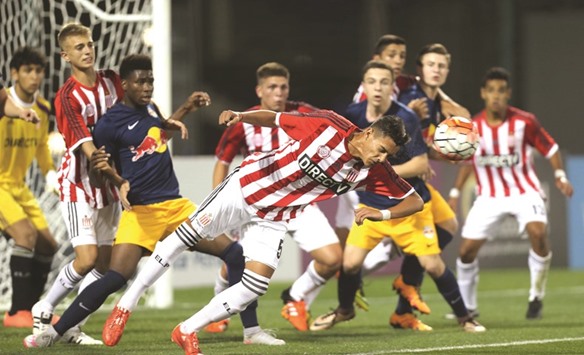Estudiantes player Nazareno Colombo (foreground) heads the ball to safety during their Al Kass International Cup match at Aspire Zone yesterday.