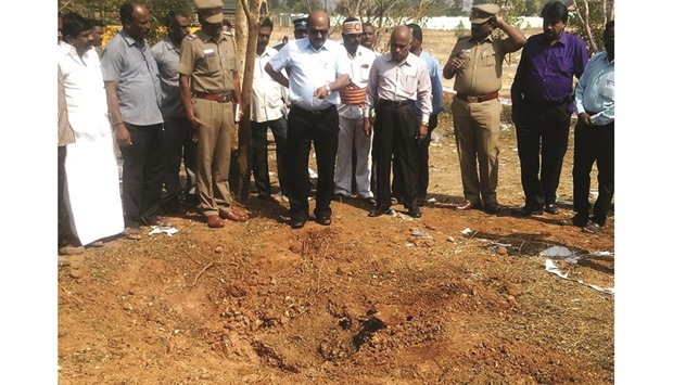 Authorities inspect the site of a suspected meteorite landing in Vellore district. If proven, it would be the first such death in recorded history. The impact of the object left a large crater in the ground and shattered window panes in a nearby building, killing a driver who was walking past.