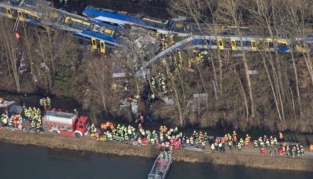 Firefighters and emergency doctors work at the site of a train accident near Bad Aibling, southern Germany, on Tuesday.