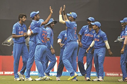 Indian players celebrate the fall of a Sri lankan wicket yesterday in Mirpur.