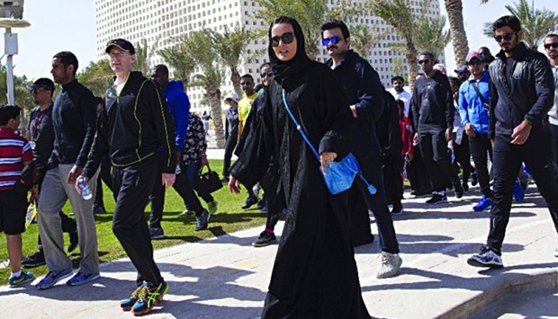 HH Sheikha Moza bint Nasser participating in the annual walkathon in Education City along with other dignitaries yesterday. PICTURE: A R Al-Baker/HHOPL