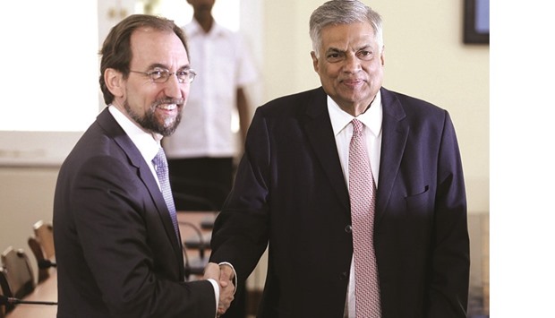 Zeid Rau2019ad al-Hussein, left, shakes hands with Sri Lankan Prime Minister Ranil Wickremesinghe during their meeting in Colombo yesterday.