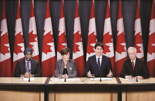 Prime Minister Justin Trudeau during a news conference with Fefence Minister Harjit Sajjan, international Development Minister Marie-Claude Bibeau and Foreign Minister Stephane Dion in Ottawa.