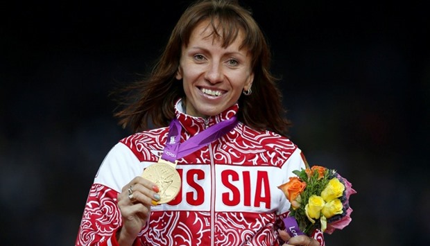 Russia's Mariya Savinova holds her gold medal during the women's 800m victory ceremony at the London 2012 Olympic Games at the Olympic Stadium, Britain August 11, 2012.