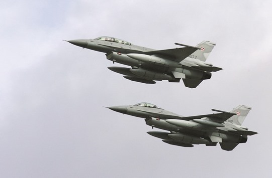 Two F-16 fighter jets arrive at the Krzesiny airport in western Poland. Lockheed said it is pushing ahead with its proposal to transfer the production line of its F-16 fighter to India.