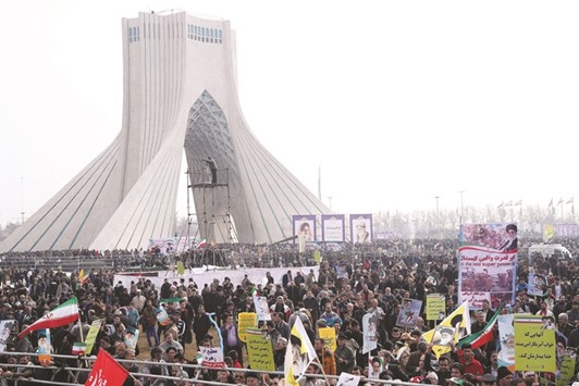 Iranians take part in a ceremony marking the anniversary of Iranu2019s 1979 Islamic Revolution, in Tehran yesterday.