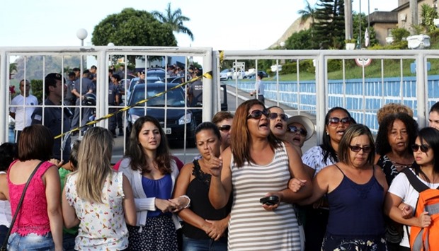 Relatives of military police officers block the main entrance of police headquarters, during a police strike over wages, in Vitoria, Espirito Santo, Brazil.