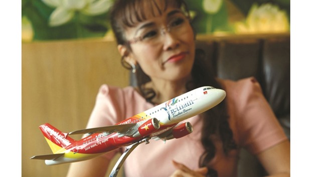 VietJet Air CEO Nguyen Thi Phuong Thao speaks behind a model of an aircraft during an interview in Ho Chi Minh City, Vietnam. GIC, Singaporeu2019s sovereign wealth fund, owns 16.44mn shares or 5.48% of the budget airline, sources said.