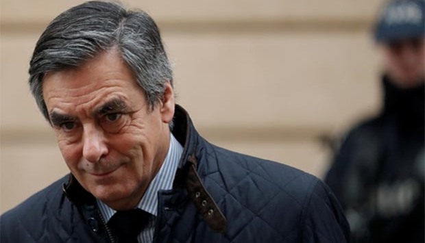 Francois Fillon, former French prime minister, member of The Republicans political party and 2017 presidential candidate of the French centre-right, leaves home in Paris on Wednesday.