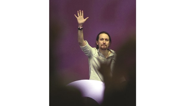 Iglesias waves during the decisive two-day party congress at Vistalegre Palace in Madrid.