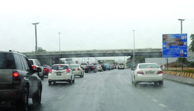 Cars make their way in the rain on Sunday. PICTURE: Shaji Kayamkulam