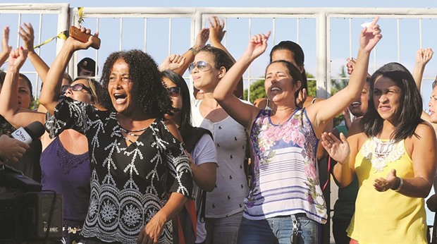 Relatives of police officers shout slogans outside the police headquarters in Vitoria, Espirito Santo.