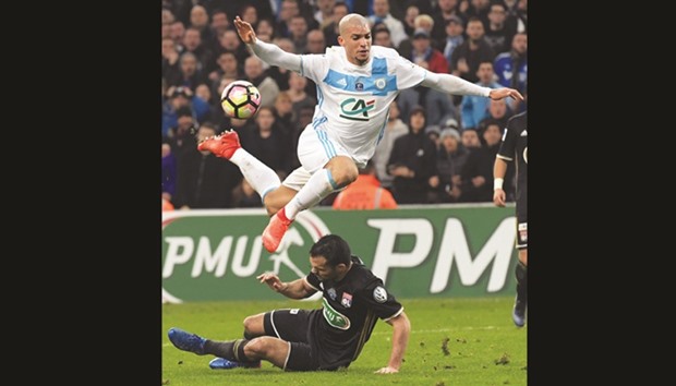 Olympique de Marseilleu2019s Matheus Macedo Doria (right) vies with Lyonu2019s defender Jeremy Morel during the French Cup match in Marseille, southern France. (AFP)