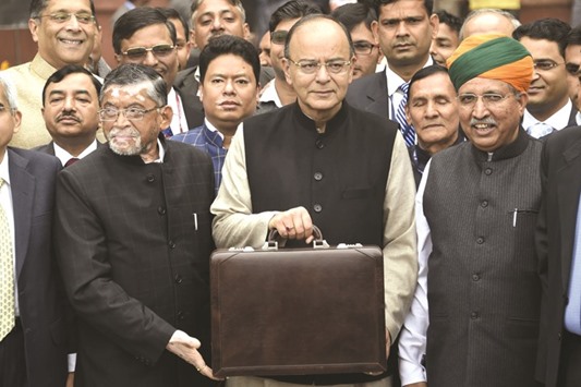 Finance Minister Arun Jaitley leaves his office to table the budget in Parliament in New Delhi yesterday.