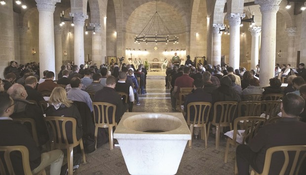 Christians attend a mass at the Church of the Multiplication of the Loaves and Fish in Tabgha, yesterday, upon itu2019s reopening following eight months of renovation.