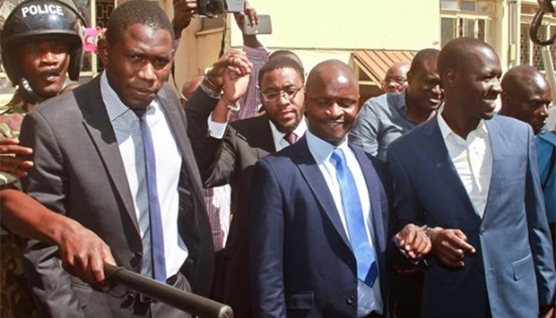 Kenya Medical Practitioners and Dentists Union's Secretary General, Dr Ouma Oluga (left) and Chairman, Dr Samuel Oroko (centre) and Dr Allan Ochanji (right) are led away in handcuffs on Monday, after a Kenyan court jailed seven union officials for a month over a doctors strike that has crippled public hospitals for 10 weeks.