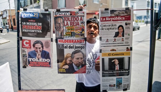 Newspapers with the portrait of former Peruvian President Alejandro Toledo on their front pages, are displayed for sale in Lima on February 10, 2017.