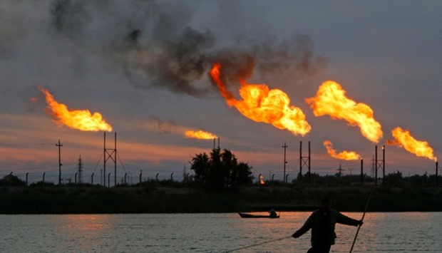 Flames emerge from flare stacks at the oil fields in Basra, Iraq.