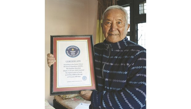 Min Bahadur Sherchan shows off his 2008 Guinness World Record certificate for being the oldest person to summit Mount Everest u2013 a record that was later broken in 2013 u2013 in Kathmandu.