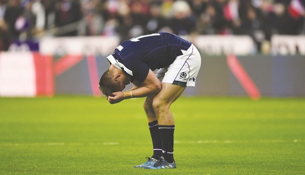 Scotlandu2019s centre Huw Jones reacts after losing the Six Nations match against France at the Stade de France in Saint-Denis. (AFP)