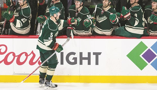 Minnesota Wild defenseman Christian Folin (No 5) celebrates his goal with teammates during the third period against the Detroit Red Wings at Xcel Energy Center. The Wild defeated the Red Wings 6-3. PICTURE: USA TODAY Sports