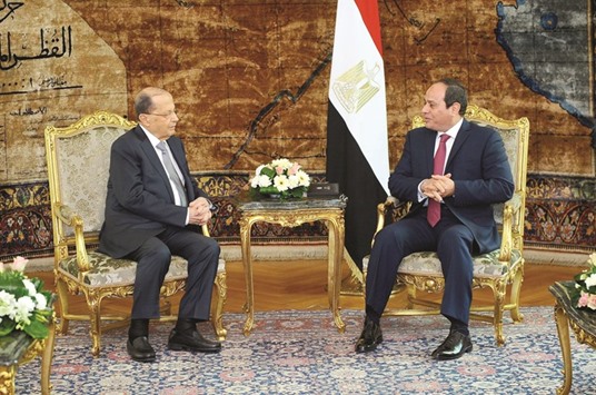 A handout picture shows Egyptian President Abdel Fattah al-Sisi meeting with Lebanese President Michel Aoun at the Presidential palace in Cairo yesterday.