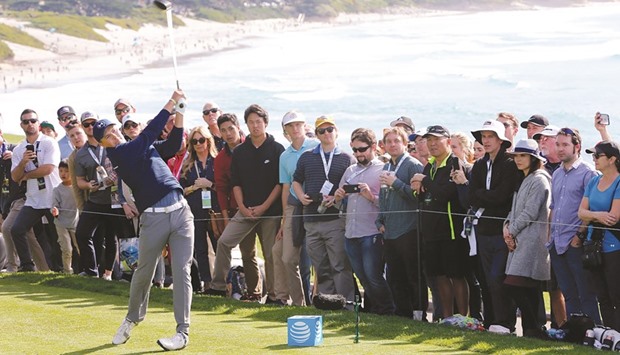 Jordan Spieth hits his tee shot on the 14th hole during the final round of the AT&T Pebble Beach Pro-Am in Pebble Beach, California, on Sunday. (AFP)