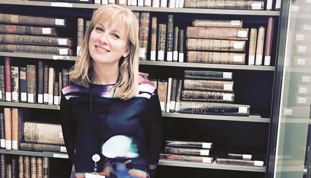 DRAWN TO BOOKS: Susan Parker-Leavy says she loves her job because u201cvariety is the spice of life and at the MIA library, you always have something new happeningu201d.