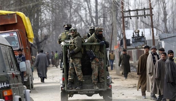 Indian paramilitary soldiers travel in a vehicle after a gunbattle in Hajin, some 38 kilometres north-east of Srinagar, on Tuesday.