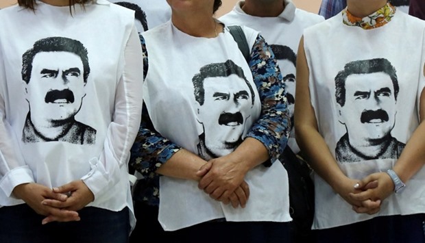 Pro-Kurdish politicians wearing t-shirts featuring Abdullah Ocalan gather to start a hunger strike to demand the right to visit the jailed PKK militant leader Ocalan, in Diyarbakir, Turkey. September 5, 2016 file picture.