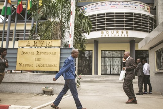 Pedestrians pass the entrance to the Regional Securities Exchange, also known as the Bourse Regionale des Valeurs Mobilieres (BRVM), in Abidjan, Ivory Coast (file).  The opening of a sukuk bond index on the BRVM last year will boost the interest for Shariah-compliant bonds in the region, said its CEO Edoh Kossi Amenounve.