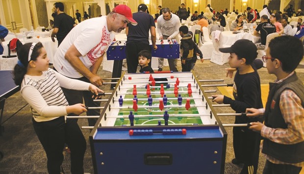 A family enjoys some of the sport activities hosted by QIB for National Sport Day.