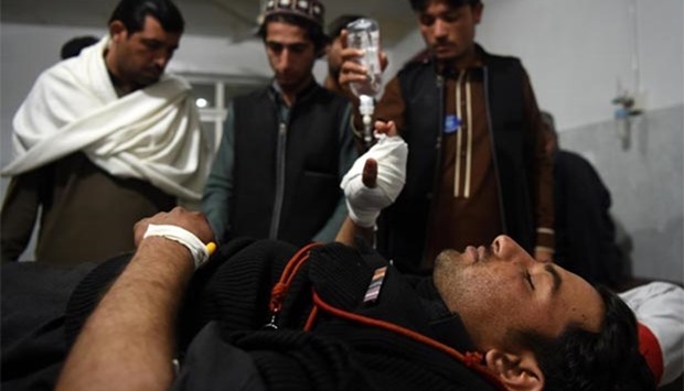 An injured Pakistani security personnel is treated at a hospital in Peshawar on Wednesday, after a suicide bombing on a government compound in Mohmand tribal agency in Pakistan's northwest.