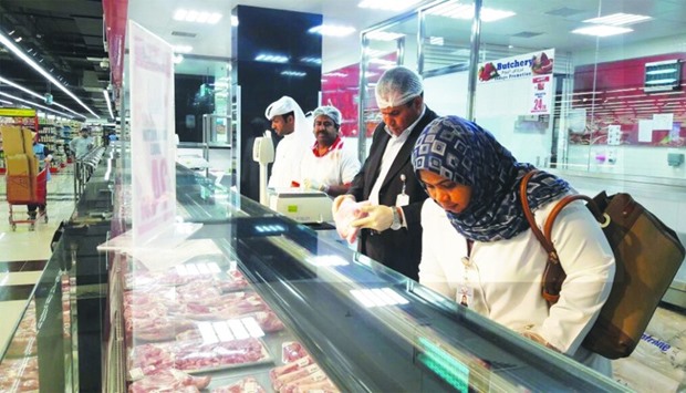 Inspectors at a meat shop during the campaign