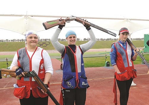 Slovakiau2019s Zuzana Rehak Stefecekova (centre) won womenu2019s Trap gold ahead of Russiau2019s Liudmila Pshenichnikova (left) and IuliiaTugolukova (right) at the Lusail Shooting Range yesterday. PICTURES: Nasar TK