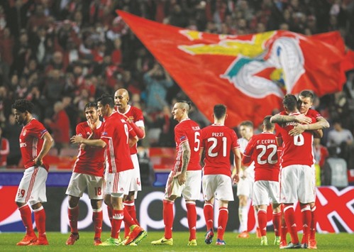 Benfica players celebrate their 1-0 win over Dortmund yesterday. (Reuters)