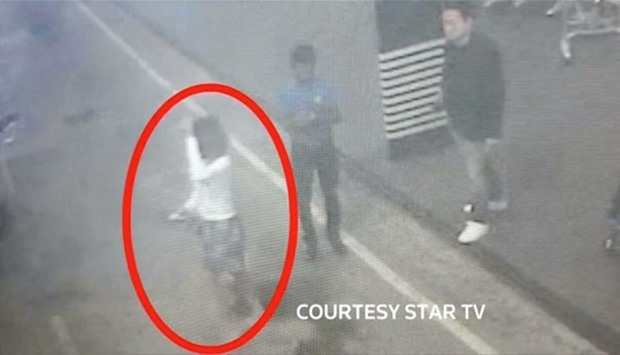 A woman who was detained at Kuala Lumpur airport, identified from CCTV footage at the airport and was alone when she was apprehended, is seen circled in red in this still frame taken from video released on Thursday.