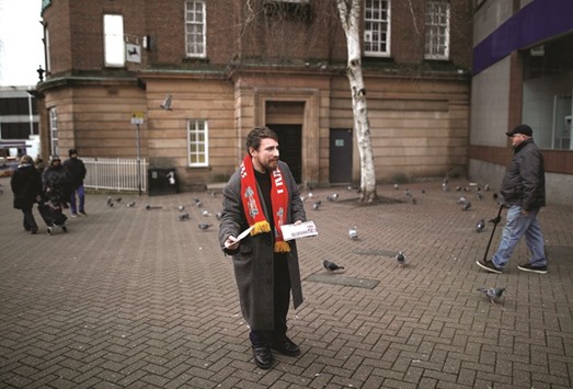 A Ukip members hands out by-election campaign leaflets in Stoke.