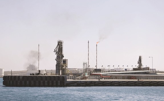 A view shows the industrial zone at the oil port of Brega, Libya. Libyau2019s crude production exceeded 700,000 bpd and is due to keep rising as working conditions in the conflict-ridden country improve for international companies like Eni and Total, an official from the state oil company said.