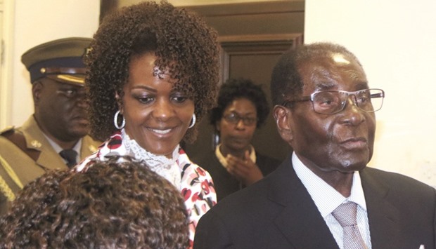 President Robert Mugabe and his wife Grace arrive to chair ZANU PFu2019s Politburo meeting at the party headquarters in Harare late on Wednesday.
