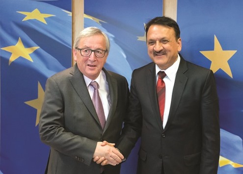 EU Commission President Jean-Claude Juncker (L) shakes hands with Foreign Minister of Nepal Prakash Sharan Mahat as he welcomes him before their bilateral meeting at the EU headquarters in Brussels on Wednesday.