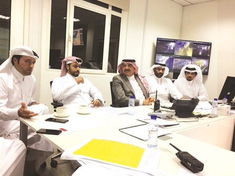 HE the Minister of Municipality and Environment Mohamed bin Abdullah al-Rumaihi discussing rainwater removal measures with officials.