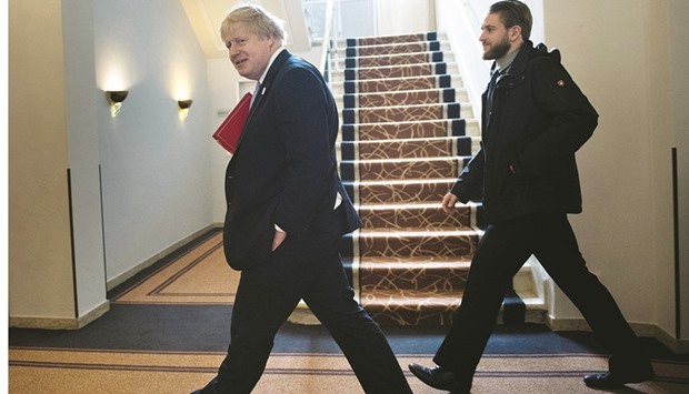 United Kingdomu2019s Foreign Secretary Boris Johnson (left) walks to a meeting in Bonn. China and Britain have in recent months announced closer cooperation in areas such as financial services as the British government prepares to negotiate the countryu2019s divorce from European Union.