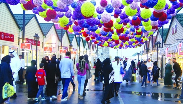 Colourful 'flower balls' at the Magical Festival Village brighten up the rainy weather. PICTURES: Jayan Orma.