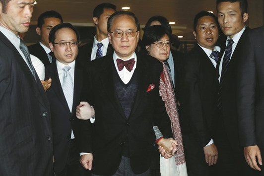 Former Hong Kong Chief Executive Donald Tsang (centre), after found guilty of misconduct, leaves the High Court on bail with his wife Selina in Hong Kong, China.