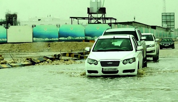 Water-logged roads slowed down motorists at many places. PICTURE: Nasar T K