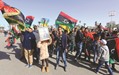 Libyans take part in a celebration marking the sixth anniversary of the Libyan revolution, at the Martyrsu2019 Square in the capital Tripoli yesterday.