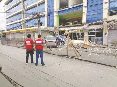 QRCS staff at a site to assess the damage caused by an earthquake in Surigao City recently.